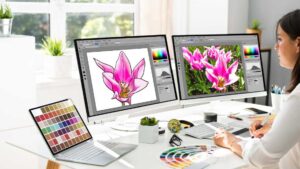 Image of a designer is seated at the desk, immersed in the world of graphic design, working on the design using a graphics tablet.